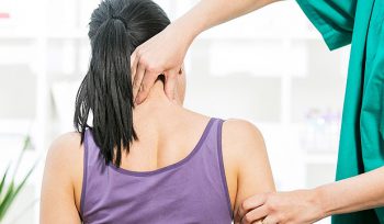 manual therapy for woman patient's neck pain